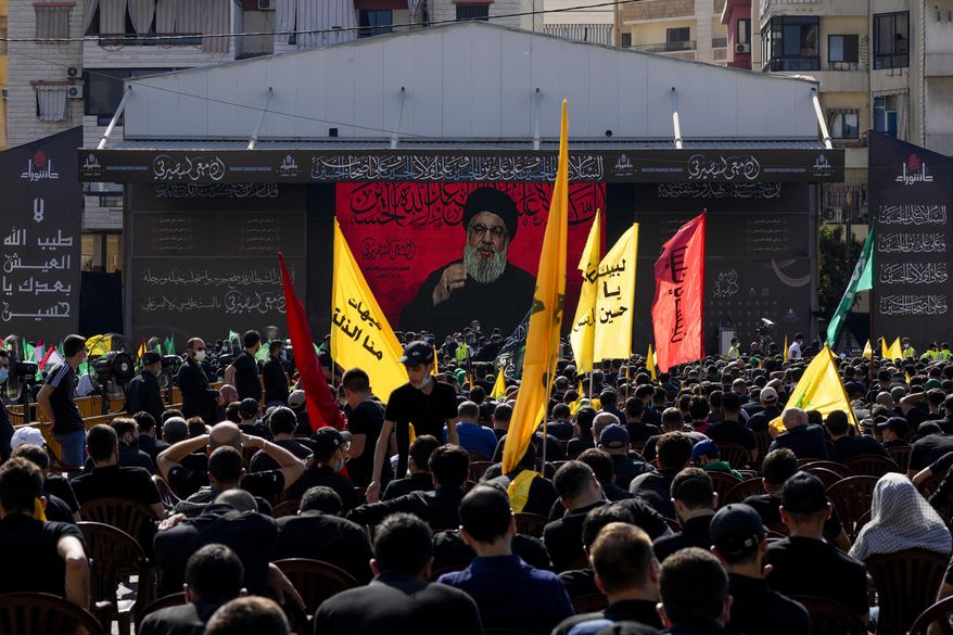 Hezbollah supporters listen to their leader Sayyed Hassan Nasrallah as he speaks via a video link during Ashoura, the Shiite Muslim commemoration marking the death of Immam Hussein, the grandson of the Prophet Muhammad, at the Battle of Karbala in present-day Iraq in the 7th century, in southern Beirut, Lebanon, Thursday, Aug. 19, 2021. Nasrallah said Thursday that the first Iranian fuel tanker will sail toward Lebanon &amp;quot;within hours&amp;quot; warning Israel and the United States not to intercept it. (AP Photo/ Hassan Ammar)