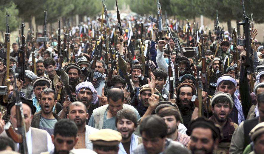 Afghan militiamen join Afghan defense and security forces during a gathering in Kabul, Afghanistan, Wednesday, June 23, 2021. (AP Photo/Rahmat Gul)