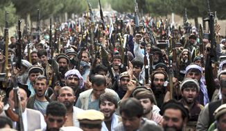 Afghan militiamen join Afghan defense and security forces during a gathering in Kabul, Afghanistan, Wednesday, June 23, 2021. (AP Photo/Rahmat Gul)