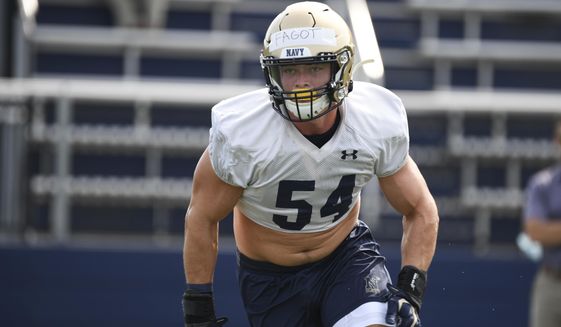 Navy linebacker Diego Fagot (54) does tackling drills during NCAA college football practice, Friday, Aug. 6, 2021, in Annapolis, Md. (AP Photo/Terrance Williams)