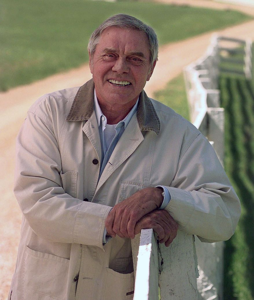 In this April 1996 file photo, Country music legend Tom T. Hall, poses for a photo at his home in Franklin, Tenn. Singer-songwriter Tom T. Hall, who composed “Harper Valley P.T.A.” and sang about life’s simple joys as country music’s consummate blue collar bard, has died. He was 85. His son, Dean Hall, confirmed the musician's death Friday, Aug. 20, 2021 at his home in Franklin, Tennessee.(AP Photo/Mark Humphrey, File) **FILE**