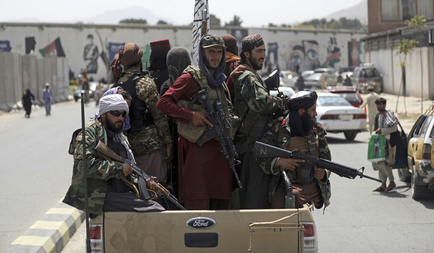In this Aug. 19, 2021, file photo, Taliban fighters patrol in Kabul, Afghanistan. In the U.S. departure from Afghanistan, China has seen the realization of long-held hopes for a reduction of the influence of a geopolitical rival in what it considers its backyard. Yet, it is also deeply concerned that the very withdrawal could bring instability to that backyard - Central Asia - and possibly even spill over the border into China itself in its heavily Muslim northwestern region of Xinjiang. (AP Photo/Rahmat Gul, File)