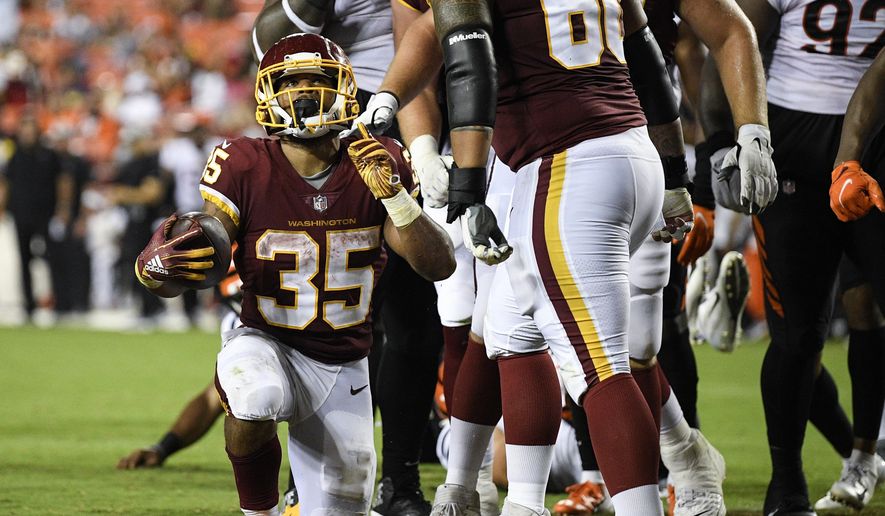 Washington Football Team running back Jaret Patterson (35) celebrates his touchdown during the second half of a preseason NFL football game against the Cincinnati Bengals, Friday, Aug. 20, 2021, in Landover, Md. (AP Photo/Nick Wass) **FILE**