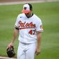 Baltimore Orioles starting pitcher John Means walks back to the dugout after he was pulled from a baseball game during the seventh inning against the Atlanta Braves, Sunday, Aug. 22, 2021, in Baltimore. (AP Photo/Nick Wass)