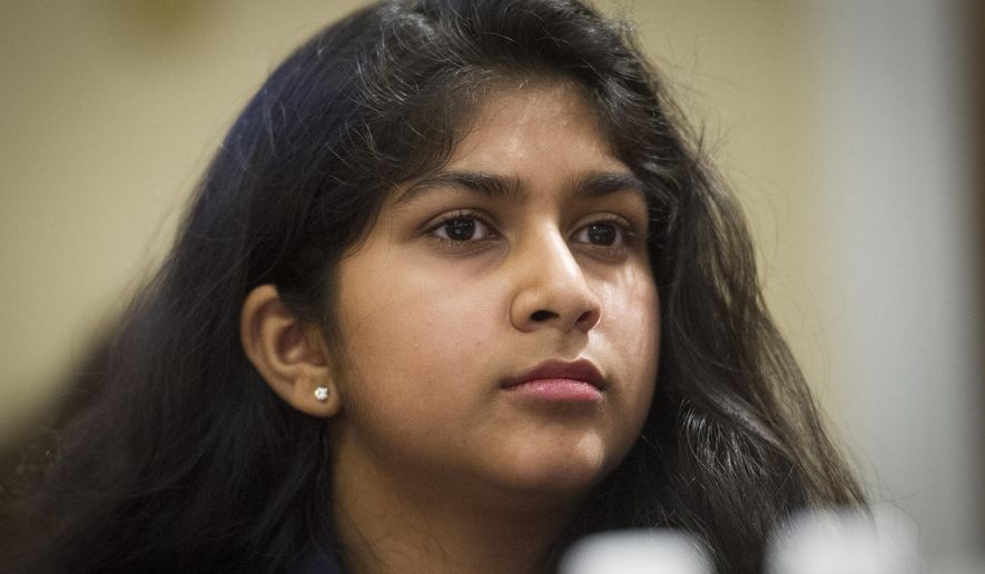 FILE - In this Feb. 6, 2019, file photo, Youth Climate March co-organizer Nadia Nazar, testifies before the House Natural Resources Committee hearing on climate change on Capitol Hill in Washington.  Born and raised in Baltimore County, 19-year-old artist and climate activist Nadia Nazar is making waves. Currently a rising sophomore at Maryland Institute College of Art, Nazar has always been inspired by art and began drawing at a young age. (AP Photo/Cliff Owen, File)