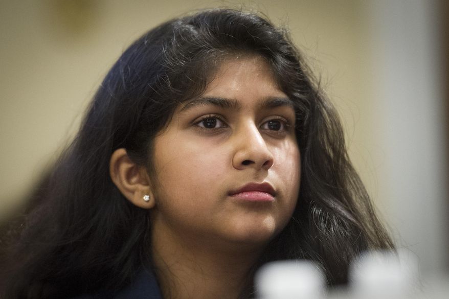 FILE - In this Feb. 6, 2019, file photo, Youth Climate March co-organizer Nadia Nazar, testifies before the House Natural Resources Committee hearing on climate change on Capitol Hill in Washington. Born and raised in Baltimore County, 19-year-old artist and climate activist Nadia Nazar is making waves. Currently a rising sophomore at Maryland Institute College of Art, Nazar has always been inspired by art and began drawing at a young age. (AP Photo/Cliff Owen, File)