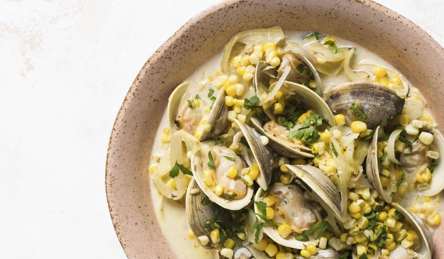 This image released by Milk Street shows a recipe for steamed clams with corn, fennel and crème fraîche. (Milk Street via AP)