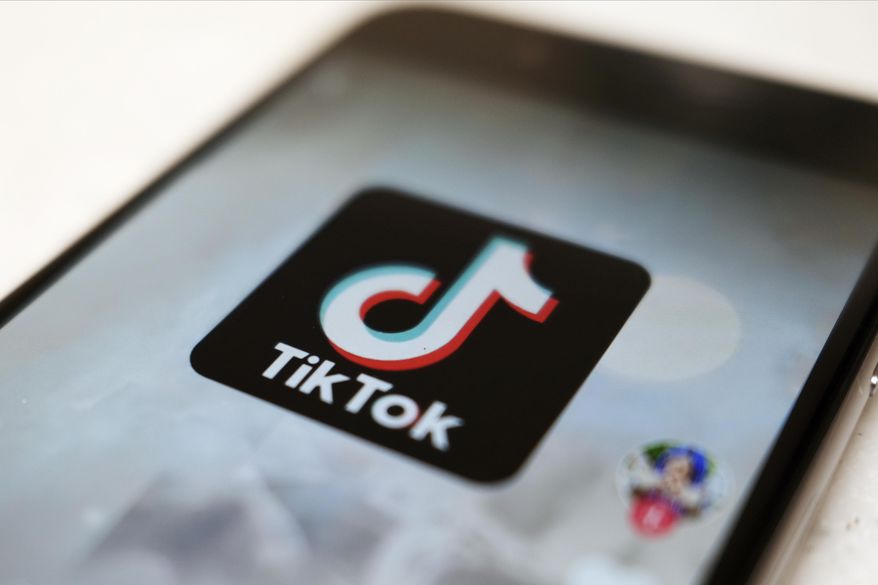 This Monday, Sept. 28, 2020, file photo, shows the TikTok logo on a smartphone in Tokyo. (AP Photo/Kiichiro Sato, File)