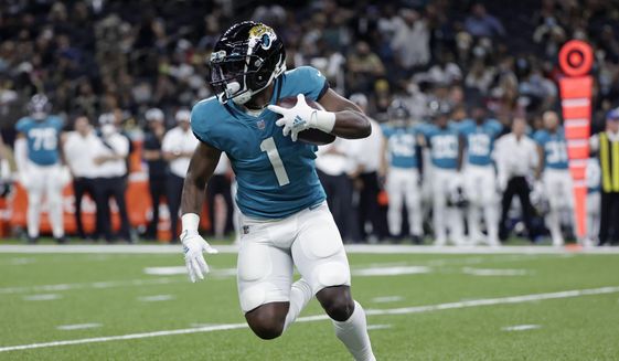 Jacksonville Jaguars running back Travis Etienne (1) carries in the first half of an NFL preseason football game in New Orleans, Monday, Aug. 23, 2021. (AP Photo/Derick Hingle) **FILE**