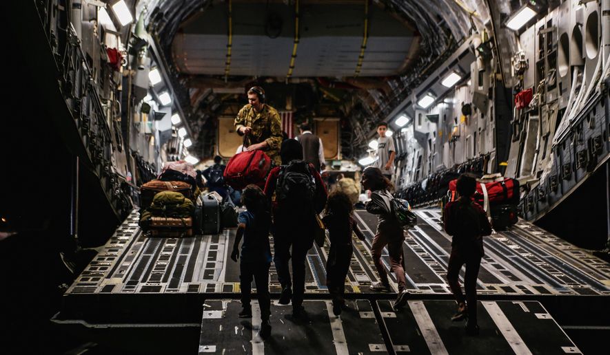 In this image provided by the U.S. Marine Corps, board a Boeing C-17 Globemaster III, at Hamid Karzai International Airport, Kabul, Afghanistan, Monday, Aug. 23, 2021. (Sgt. Isaiah Campbell/U.S. Marine Corps via AP)