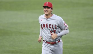 Los Angeles Angels&#x27; Shohei Ohtani (17) jogs on the field before a baseball game against the Baltimore Orioles, Tuesday, Aug. 24, 2021, in Baltimore. (AP Photo/Terrance Williams)