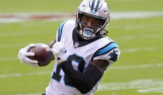 In this Nov. 8, 2020, photo, Carolina Panthers wide receiver Curtis Samuel (10) runs to the end zone against the Kansas City Chiefs during the first half of an NFL football game in Kansas City, Mo. Washington has been practicing without receiver Curtis Samuel for the balance of training camp and without cornerback William Jackson for the past week. Samuel and Jackson were the team&#39;s highest-priced free-agent additions. (AP Photo/Orlin Wagner, File) **FILE**