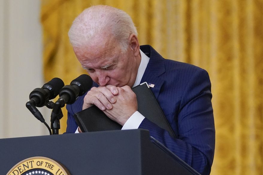 President Joe Biden pauses as he speaks about the bombings at the Kabul airport that killed at least 12 U.S. service members, from the East Room of the White House, Thursday, Aug. 26, 2021, in Washington. (AP Photo/Evan Vucci)