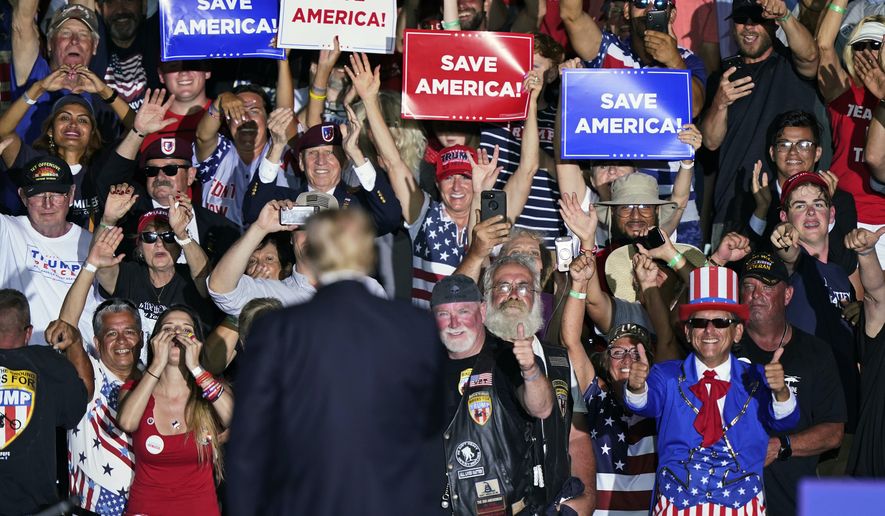 Supporters cheer on former President Donald Trump after he spoke at a rally at the Lorain County Fairgrounds, Saturday, June 26, 2021, in Wellington, Ohio. (AP Photo/Tony Dejak)