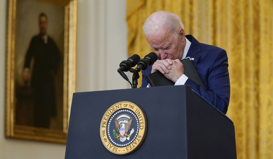 President Joe Biden pauses as he listens to a question about the bombings at the Kabul airport that killed at least 12 U.S. service members, from the East Room of the White House, Thursday, Aug. 26, 2021, in Washington. (AP Photo/Evan Vucci)