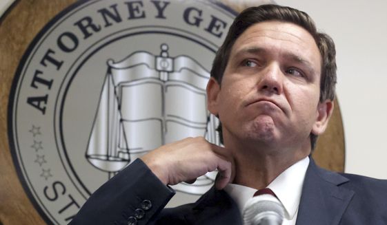 Florida Governor Ron DeSantis listens to a question during a press conference with Florida Attorney General Ashley Moody in Orlando, Fla., Thursday, Aug. 26, 2021, announcing that the state&#39;s Department of Children and Families (DCF) and the Florida Office of Attorney General have recovered $5 million from the Florida Coalition Against Domestic Violence. (Joe Burbank/Orlando Sentinel via AP) **FILE**