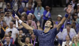 Novak Djokovic, of Serbia, celebrates after defeating Juan Martin del Potro, of Argentina, in the men&#39;s final of the U.S. Open tennis tournament in New York, in this Sunday, Sept. 9, 2018, file photo. Djokovic&#39;s pursuit of tennis history -- the first calendar-year Grand Slam by a man in more than a half-century and a men&#39;s-record 21st major title -- means all eyes will be on him when he is on the court at the U.S. Open. (AP Photo/Julio Cortez, File) **FILE**