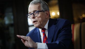 FILE - In this Dec. 13, 2019, file photo, Ohio Gov. Mike DeWine speaks during an interview at the Governor&#39;s Residence in Columbus, Ohio. Republican Ohio Gov. Mike DeWine has cited restrictions on his emergency powers as a reason he is no longer issuing orders to fight the COVID-19 pandemic, even as Democratic opponent Nan Whaley has called on him to issue a mask mandate for K-12 schools. (AP Photo/John Minchillo, File)