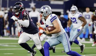 In this Aug. 21, 2021, file photo, Dallas Cowboys quarterback Ben DiNucci, front right, runs the ball as Houston Texans defensive end Shaq Lawson (93) pursues in the second half of a preseason NFL football game in Arlington, Texas. The New York Jets have acquired edge rusher Lawson from the Texans in exchange for a sixth-round pick in next year&#39;s NFL draft, according to a person with direct knowledge of the deal. (AP Photo/Michael Ainsworth, File) **FILE**