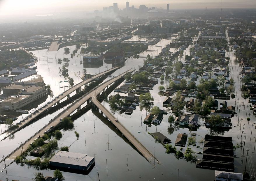 FILE - In this Aug. 30, 2005 file photo, Floodwaters from Hurricane Katrina fill the streets near downtown New Orleans. Hurricane Ida looks an awful lot like Hurricane Katrina, bearing down on the same part of Louisiana on the same calendar date. But hurricane experts say there are differences in the two storms 16 years apart that may prove key and may make Ida nastier in some ways but less dangerous in others.(AP Photo/David J. Phillip, File)
