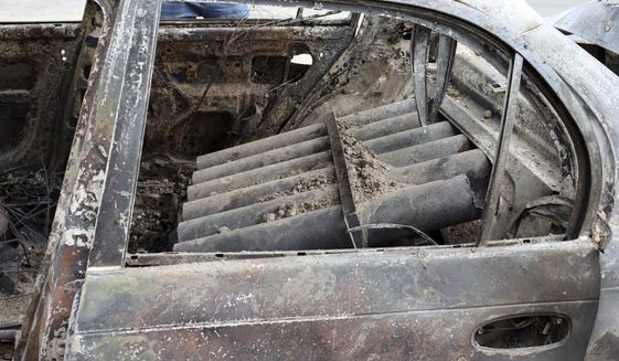 Rocket launcher tubes are seen inside a destroyed vehicle in Kabul, Afghanistan, Monday, Aug. 30, 2021. Rockets struck a neighborhood near Kabul&#39;s international airport on Monday amid the ongoing U.S. withdrawal from Afghanistan. It wasn&#39;t immediately clear who launched them. (AP Photo/Khwaja Tawfiq Sediqi)
