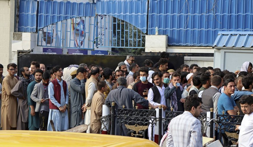 Afghans wait in long lines for hours to try to withdraw money, in front of a Bank in Kabul, Afghanistan, Monday, Aug. 30, 2021. Many Afghans are anxious about the Taliban rule and are figuring out ways to get out of Afghanistan. But it&#x27;s the financial desperation that seems to hang heavy over the city. (AP Photo/Khwaja Tawfiq Sediqi)