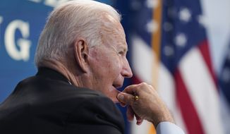 President Joe Biden listens during a virtual meeting with FEMA Administrator Deanne Criswell and governors and mayors of areas impacted by Hurricane Ida, in the South Court Auditorium on the White House campus, Monday, Aug. 30, 2021, in Washington. (AP Photo/Evan Vucci)