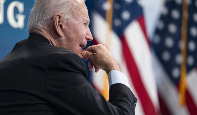 President Joe Biden listens during a virtual meeting with FEMA Administrator Deanne Criswell and governors and mayors of areas impacted by Hurricane Ida, in the South Court Auditorium on the White House campus, Monday, Aug. 30, 2021, in Washington. (AP Photo/Evan Vucci)g
