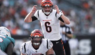 Cincinnati Bengals quarterback Kyle Shurmur (6) signals the offensive line during an NFL football game against the Miami Dolphins, Sunday, Aug. 29, 2021, in Cincinnati. (AP Photo/Zach Bolinger)