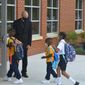 Youngsters enter the first new Catholic school built in Baltimore in roughly 60 years with a mix of enthusiasm and first-day-back jitters, Monday Aug. 30, 2021. The new 65,000 square foot school near downtown Baltimore is an anomaly in the national education landscape where the pandemic has shuttered many parish schools. It&#39;s named after Mother Mary Lange, who started a Catholic school for Black children in 1828 _ the first U.S. Catholic school for African-American youth. (AP Photo/David McFadden)