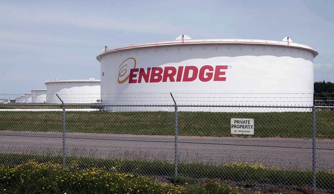 This June 29, 2018 file photo shows tanks at the Enbridge Energy terminal in Superior, Wis. The state of Minnesota has gone to federal court to block a lawsuit over Enbridge Energy&#x27;s Line 3 oil pipeline project from proceeding in tribal court. The novel case names Manoomin — the Ojibwe word for wild rice — as the lead plaintiff. Wild rice is sacred in Ojibwe culture and a traditional source of food. The lawsuit, which was filed two weeks ago in the White Earth Band&#x27;s tribal court, is the first &quot;rights of nature&quot; enforcement case brought in a U.S. tribal court and the second such case to be filed in any U.S. court. (AP Photo/Jim Mone, File)  **FILE**