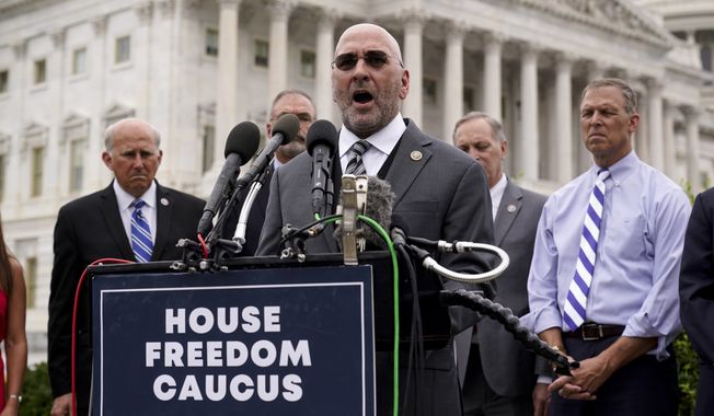 Rep. Clay Higgins, R-La., and other members of the conservative House Freedom Caucus call for the removal of President Joe Biden over the close of the war in Afghanistan, at the Capitol in Washington, Tuesday, Aug. 31, 2021. (AP Photo/J. Scott Applewhite) ** FILE ***