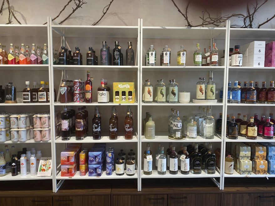 Non-alcoholic spirits are displayed at Boisson in New York in August 2021. Interest in a sober lifestyle has been growing for years, leading to the rise of mocktails and alcohol-free bars. The pandemic led even more people to question boozy drinking habits. Non-alcoholic options range from drinks that aim to replicate existing spirits to ones that promise something completely new. (Katie Workman via AP)