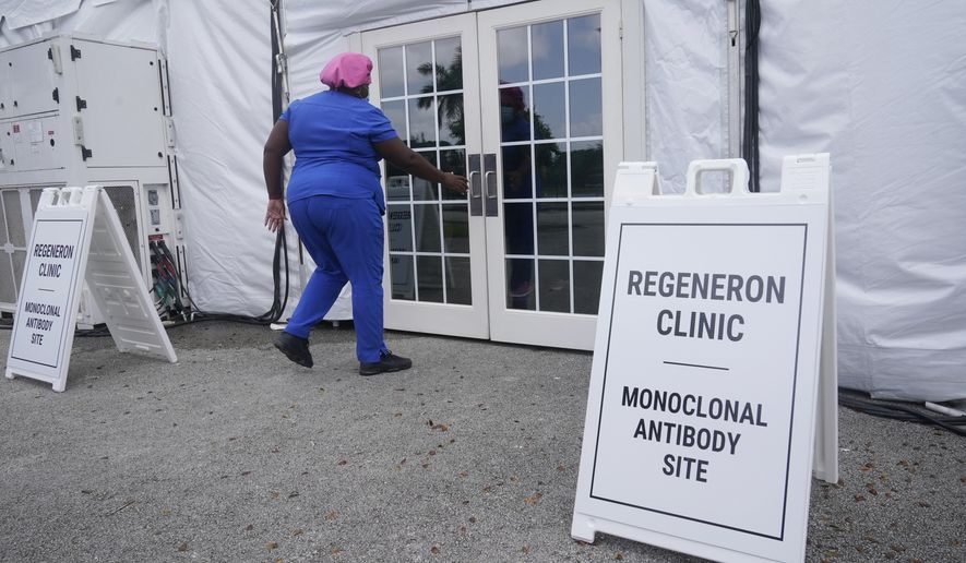 A nurse enters a monoclonal antibody site, Wednesday, Aug. 18, 2021, at C.B. Smith Park in Pembroke Pines, Fla. Minnesota&#39;s health department, under threat of a lawsuit, has removed race as a preferential factor in deciding which COVID-19 patients will receive monoclonal antibody treatments. (AP Photo/Marta Lavandier) **FILE**