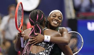 Sloane Stephens, of the United States, right, hugs Coco Gauff, of the United States, after Stephens won their match during the second round of the US Open tennis championships, Wednesday, Sept. 1, 2021, in New York. (AP Photo/John Minchillo)