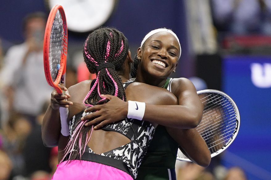 Sloane Stephens, of the United States, right, hugs Coco Gauff, of the United States, after Stephens won their match during the second round of the US Open tennis championships, Wednesday, Sept. 1, 2021, in New York. (AP Photo/John Minchillo)
