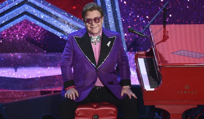 Elton John is seen after performing &amp;quot;(I&#x27;m Gonna) Love Me Again&amp;quot; nominated for the award for best original song from &amp;quot;Rocketman&amp;quot; at the Oscars on Feb. 9, 2020, at the Dolby Theatre in Los Angeles. John is releasing an album of collaborations with artists from several generations and genres, including Nicki Minaj, Young Thug, Miley Cyrus, Lil Nas X, Stevie Nicks and Stevie Wonder. “The Lockdown Sessions,” a collection of 16 songs featuring John with artists from Dua Lipa to the late Glen Campbell, will be released on Oct. 22. (AP Photo/Chris Pizzello, File)
