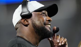 Pittsburgh Steelers head coach Mike Tomlin smiles during the second half of a preseason NFL football game against the Carolina Panthers Friday, Aug. 27, 2021, in Charlotte, N.C. (AP Photo/Jacob Kupferman)