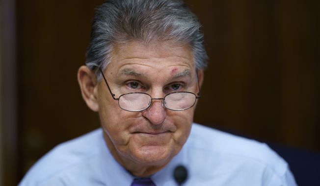 FILE - In this Aug. 5, 2021, file photo Sen. Joe Manchin, D-W.Va., prepares to chair a hearing in the Senate Energy and Natural Resources Committee, as lawmakers work to advance the $1 trillion bipartisan bill, at the Capitol in Washington. Manchin said Thursday, Sept. 2, that Congress should take a strategic pause on more spending, warning that he does not support President Joe Biden&#x27;s plans for a sweeping $3.5 trillion effort to rebuild and reshape the economy. (AP Photo/J. Scott Applewhite, File)