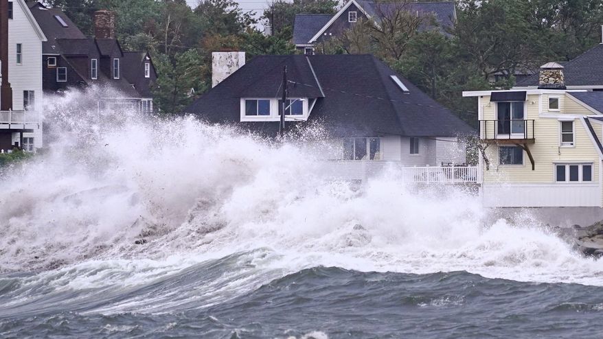 Waves slam along the shore near high tide as the remnants of Hurricane Ida leave coastal Massachusetts, Thursday, Sept. 2, 2021, in Scituate, Mass. (AP Photo/Charles Krupa)