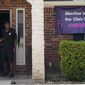 In this Sept. 1, 2021 file photo, a security guard opens the door to the Whole Women&#39;s Health Clinic in Fort Worth, Texas.  (AP Photo/LM Otero)  **FILE**