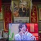 FILE - In this June 4, 2021, file photo, a television shows a broadcast of a Chinese talk show program as it sits beneath a photo of Chinese President Xi Jinping in a home converted into a tourist homestay in Zhaxigang village near Nyingchi in western China&#39;s Tibet Autonomous Region. China&#39;s government banned effeminate men on TV and told broadcasters Thursday, Sept. 2, 2021 to promote &amp;quot;revolutionary culture,&amp;quot; broadening a campaign to tighten control over business and society and enforce official morality. (AP Photo/Mark Schiefelbein, File)