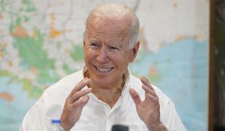 President Joe Biden participates in a briefing about the response to damage caused by Hurricane Ida, at the St. John Parish Emergency Operations Center, Friday, Sept. 3, 2021, in LaPlace, La. (AP Photo/Evan Vucci)