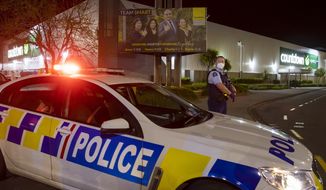 Police stand outside the site of a knife attack at a supermarket in Auckland, New Zealand, Friday, Sept. 3, 2021. New Zealand authorities say they shot and killed a violent extremist after he entered the supermarket and stabbed and injured six shoppers. New Zealand Prime Minister Jacinda Ardern described Friday&#39;s incident as a terror attack. (AP Photo/Brett Phibbs)