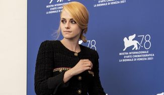 Kristen Stewart poses for photographers at the photo call for the film &#39;Spencer&#39; during the 78th edition of the Venice Film Festival in Venice, Italy, Friday, Sep, 3, 2021. (Photo by Joel C Ryan/Invision/AP)