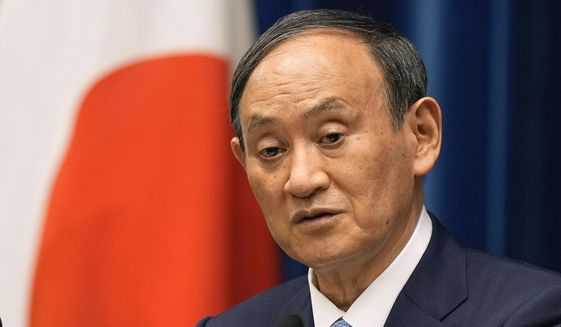 In this Aug. 17, 2021, file photo, Japanese Prime Minister Yoshihide Suga speaks during a news conference at the prime minister&#39;s official residence in Tokyo. Broadcaster NHK says Friday, Sept. 3, 2021, Suga won&#39;t run for party leader, hinting he will resign as Japanese leader at the end of September. (Kimimasa Mayama/Pool Photo via AP, File)