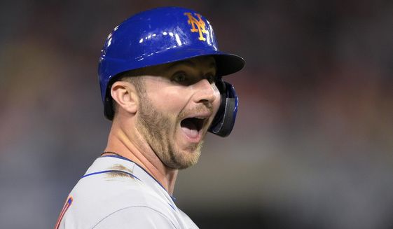 New York Mets&#39; Pete Alonso reacts at third after he hit an RBI triple during the third inning of the team&#39;s baseball game against the Washington Nationals, Friday, Sept. 3, 2021, in Washington. (AP Photo/Nick Wass)