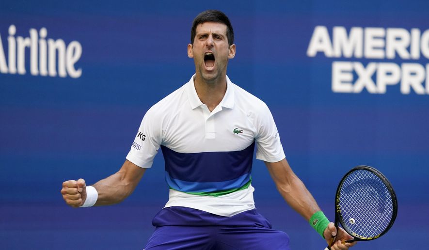 Novak Djokovic, of Serbia, reacts after scoring a point against Kei Nishikori, of Japan, during the third round of the US Open tennis championships, Saturday, Sept. 4, 2021, in New York. (AP Photo/John Minchillo) **FILE**