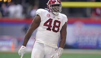 Alabama defensive lineman Phidarian Mathis (48) reacts after recovering a Miami fumble during the first half of an NCAA college football game Saturday, Sept. 4, 2021, in Atlanta. (AP Photo/John Bazemore) **FILE **