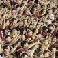 Florida State fans, almost none of whom were complying with the mandatory mask mandate, do The Chop during an NCAA college football game against Notre Dame Sunday, Sept. 5, 2021, in Tallahassee, Fla. Notre Dame won 41-38 in overtime, (AP Photo/Phil Sears)